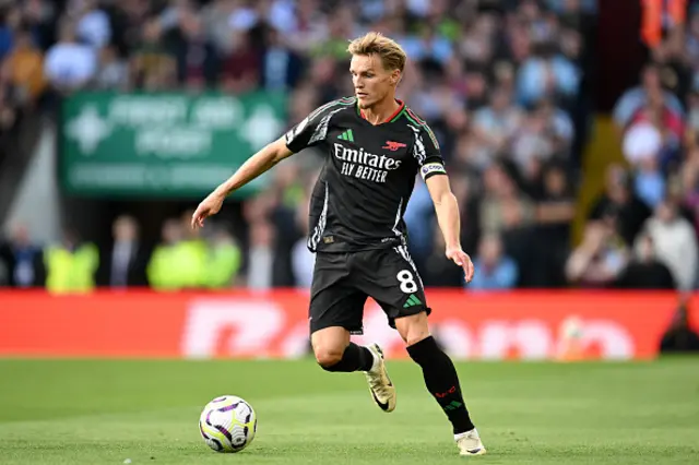 Martin Odegaard of Arsenal runs with the ball