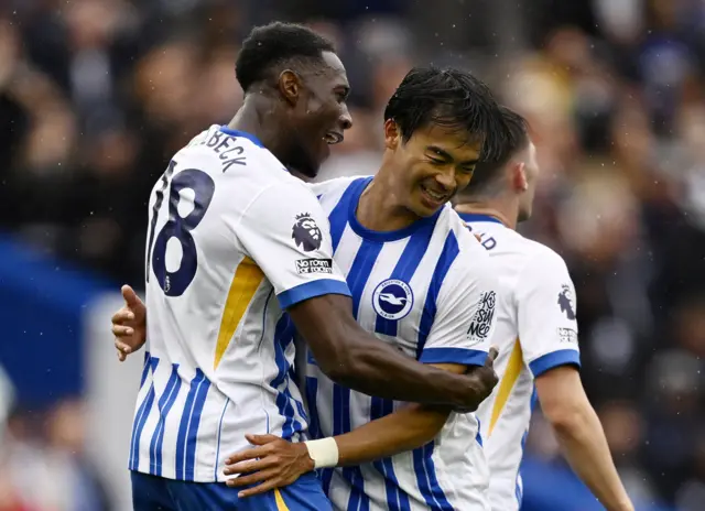 Danny Welbeck celebrates scoring their first goal with Kaoru Mitoma