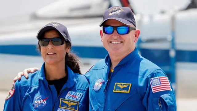 NASA astronauts Butch Wilmore and Suni Williams pose ahead of a previous flight