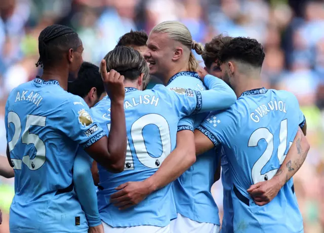 City celebrate with Haaland after his hat-trick goal