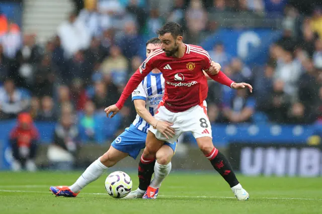 Bruno Fernandes of Manchester United is challenged by Billy Gilmour