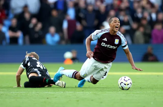 Odegaard is tackled by Tielemans