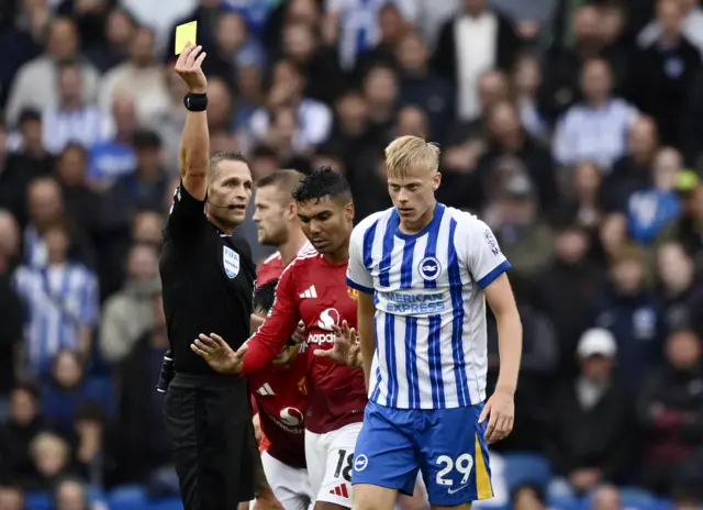 Van hecke walks away as he is shown a yellow card