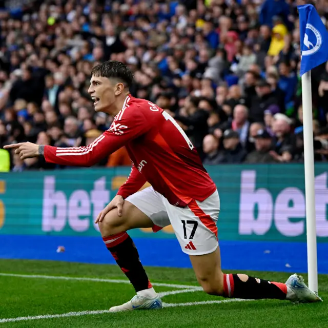 Garnacho celebrates his goal at the corner flag