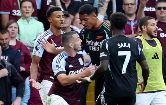 John McGinn clashes with Arsenal's William Saliba