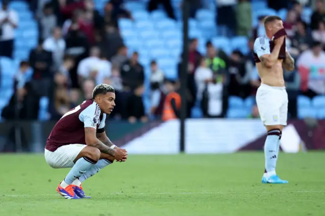 Rogers stands on his haunches as Barkley wipes his face with his shirt