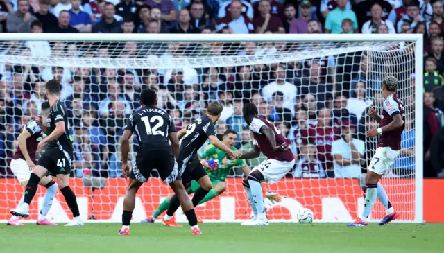 Trossard strokes the ball beyond Martinez to give Arsenal the lead