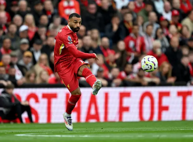 Salah curls a pass forward