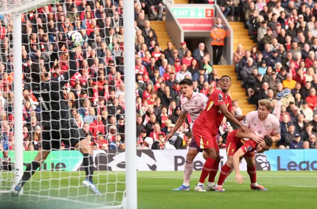 Alisson saves on the line from a headed chance