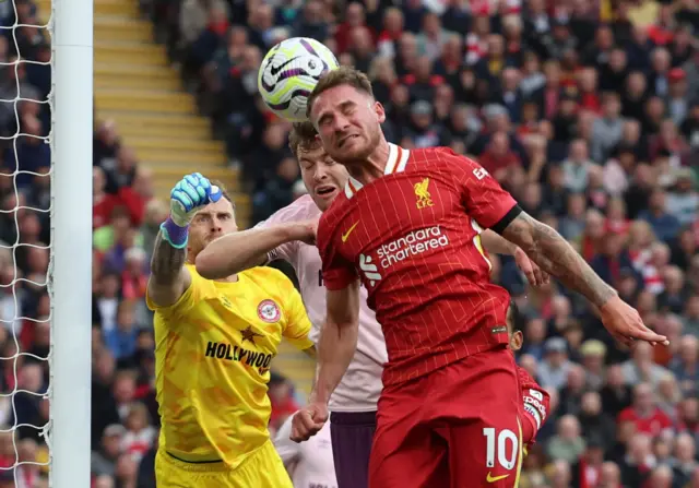 Flekken punches the ball clear