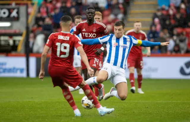 Aberdeen's Ester Sokler is fouled by Kilmarnock's Brad Lyons