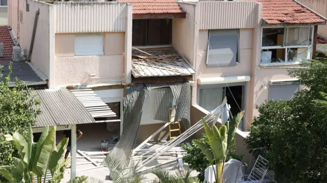 Debris caused by the rocket attacks on a home in Acco