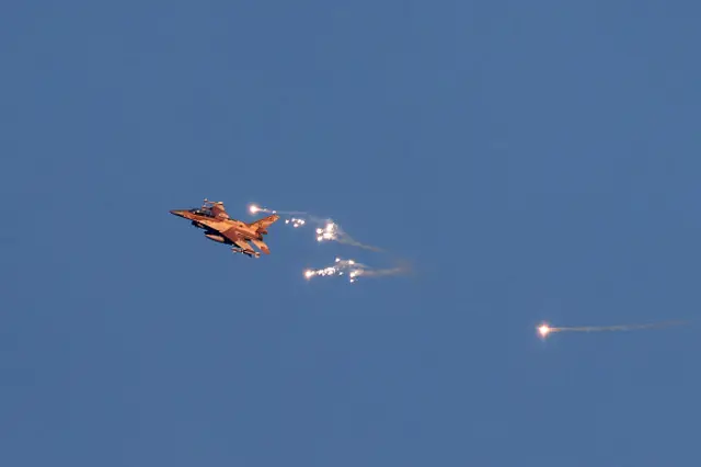 sraeli Air Force fighter jet firing flares as it flies to intercept a hostile aircraft that launched from Lebanon over the border area with south Lebanon on August 25