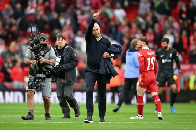 Liverpool boss Arne Slot giving the Kop a thumbs up