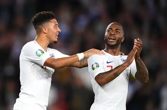 Jadon Sancho of England celebrates with team mates Raheem Sterling