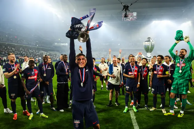 Manuel Ugarte of Paris Saint-Germain (PSG) is celebrating with the trophy