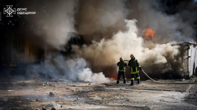 Firefighters battle a blaze after a missile strike in Odesa