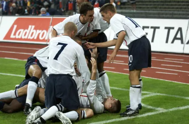 England players pile on after scoring