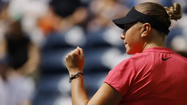 Amanda Anisimova celebrates winning a point