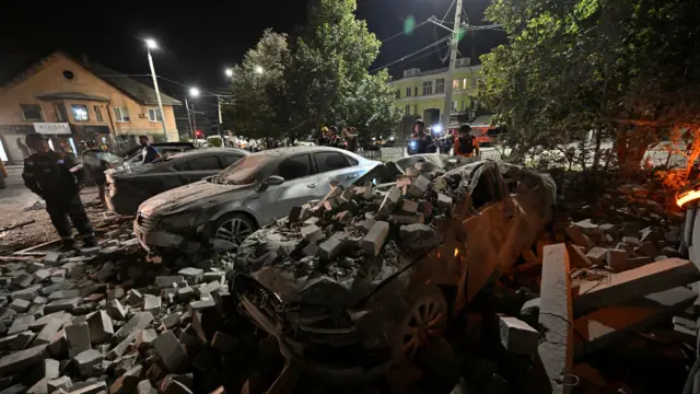 A car is crushed under rubble in the Ukrainian city of Kryvyi Rih