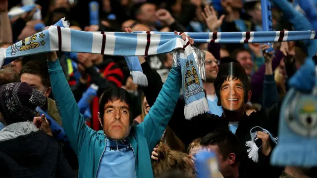 Masks of the Gallagher brothers at Manchester City