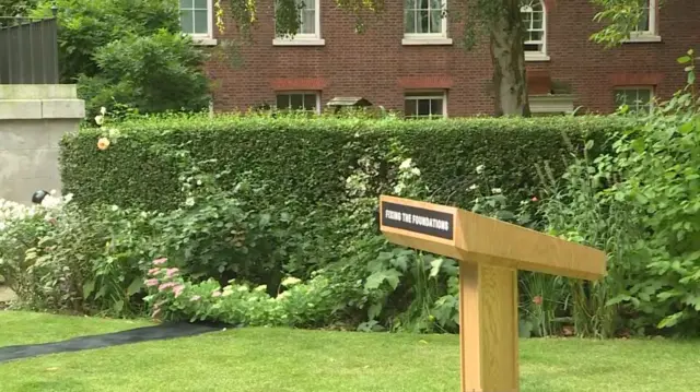 The Downing Street lectern, with the slogan "fixing the foundations"