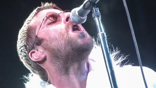 Liam Gallagher performing during Oasis' Glastonbury headline slot in 2004