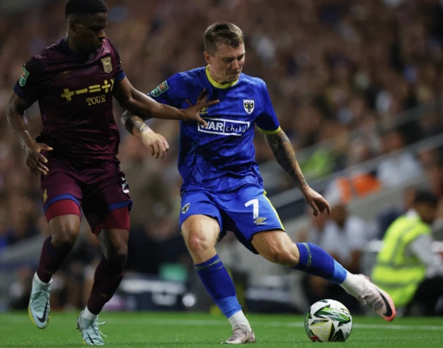 James Tilley in action with Ipswich Town's Chiedozie Ogbene