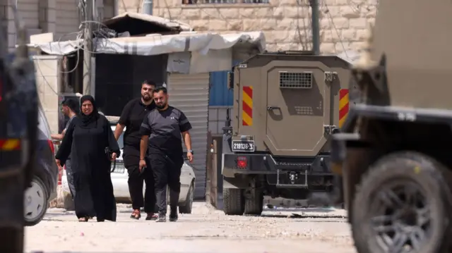 Palestinians leaving a hospital in Jenin during Israeli army operation in the city