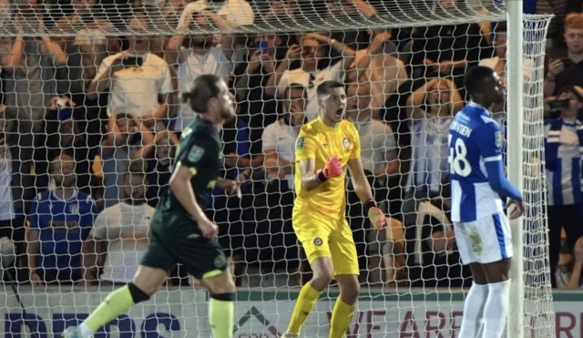 Brentford goalkeeper Hakon Rafn Valdimarsson (centre) reacts