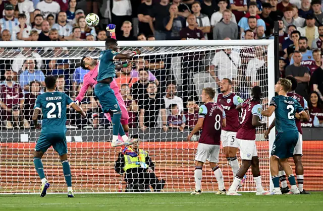 Lukasz Fabianski of West Ham United saves a high ball from Dango Ouattara