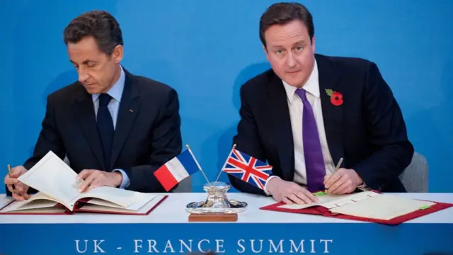 French President Nicolas Sarkozy and UK Prime Minister David Cameron signing documents in 2010