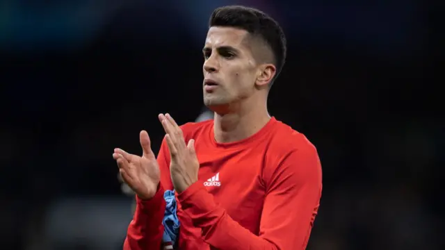 Joao Cancelo applauding while leaving the field