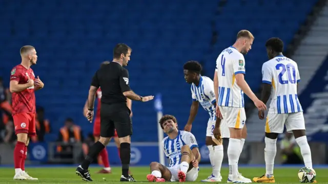 Matt O'Riley down injured after a heavy tackle on his Brighton debut