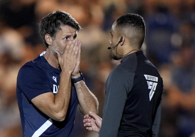 anny Cowley (left) complains to the fourth official after Brentford score