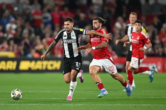 Bruno Guimaraes of Newcastle United is challenged by Jota Silva