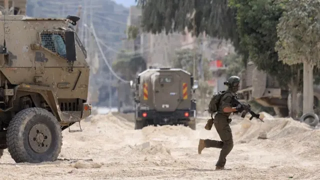 An Israeli soldier operates during a raid in the Nur Shams camp for Palestinian refugees near the city of Tulkarem in the Israeli-occupied West Bank on August 28, 2024.