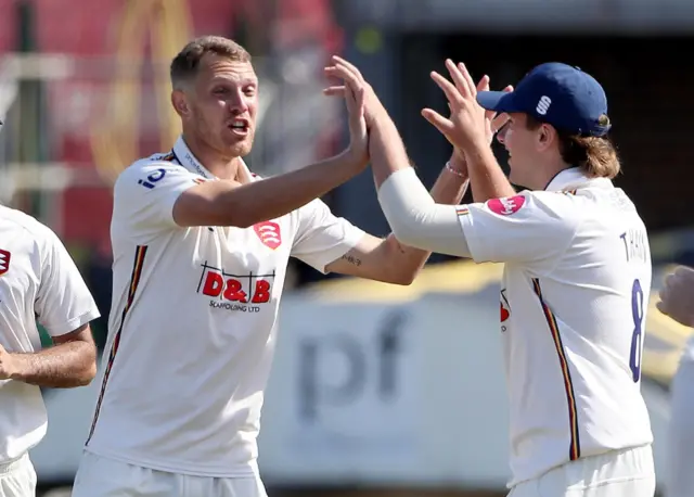 Jamie Porter celebrates taking a wicket