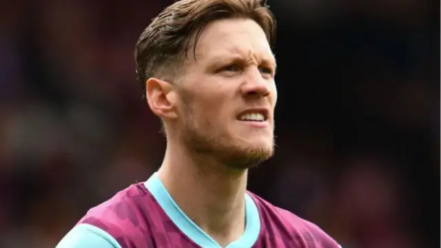 Wout Weghorst grimaces while playing for Burnley