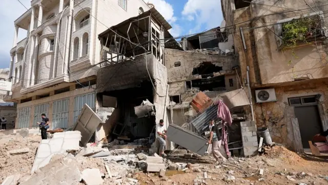 Palestinians, inspect the destroyed area after the Israeli soldiers raided Nur Shams Refugee Camp in Tulkarm, West Bank on August 29, 2024. Israeli military bulldozers damaged infrastructure and Palestinian property by digging up roads