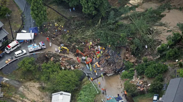 Aerial view of a search and rescue operation underway after heavy rain causes a landslide in Gamagori