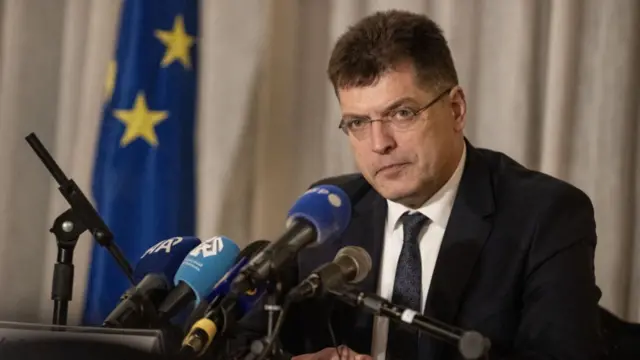 Janez Lenarcic at a press conference in March 2024 in Jerusalem, sitting in front of microphones