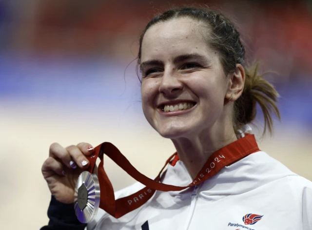 Daphne Schrager of Britain celebrates on the podium