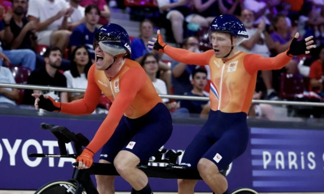 Tristan Bangma of Netherlands and pilot Patrick Bos celebrate