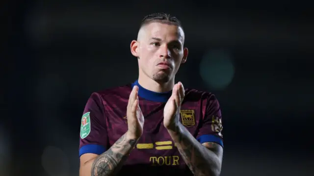 Kalvin Phillips applauds the Ipswich fans after the team's Carabao Cup exit at Wimbledon