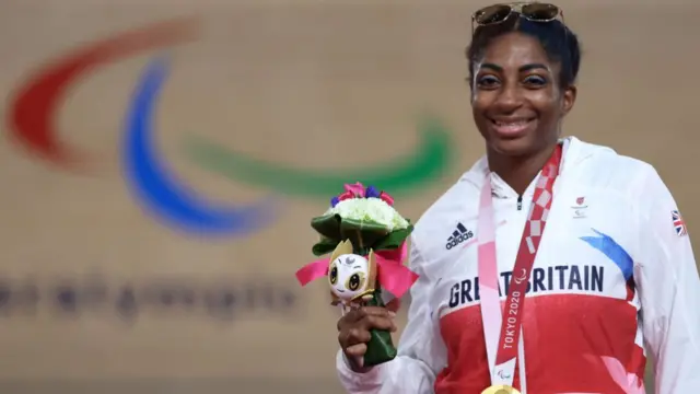 Kadeena Cox proudly wears her gold medal in Tokyo