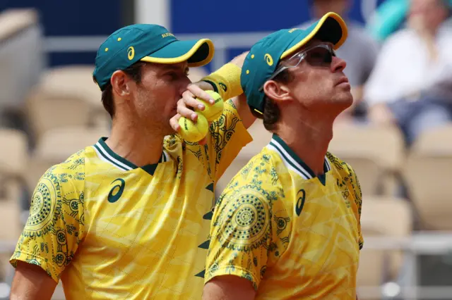 Matthew Ebden and John Peers in doubles action at Paris 2024