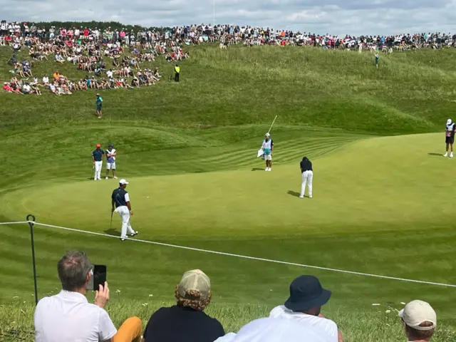 Tommy Fleetwood lines up a putt