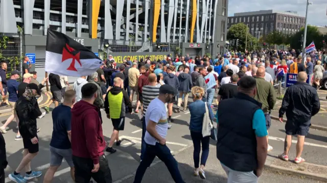 Protestors marching towards the city centre in Hanley