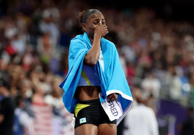 Julien Alfred of Team Saint Lucia celebrates winning the gold